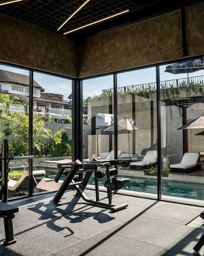 gym workout equipment and pool n a bali fitness retreat