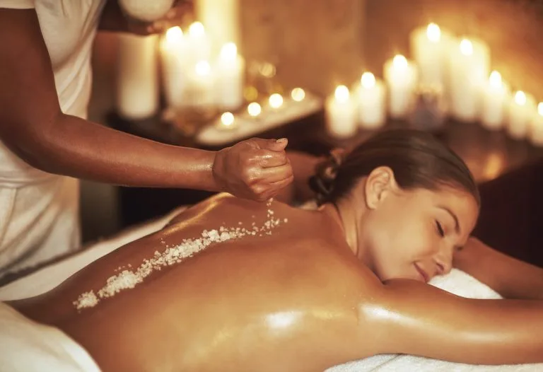 Bali retreat woman enjoying a body sea salt scrub for relaxation and rejuvenation