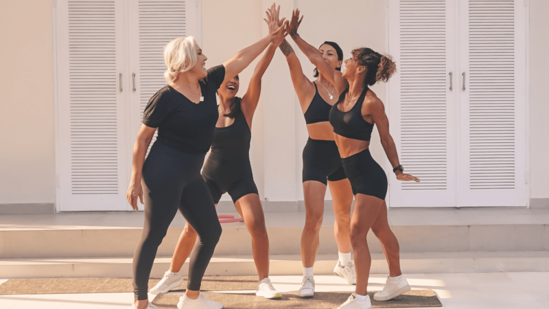 women work out by the pool