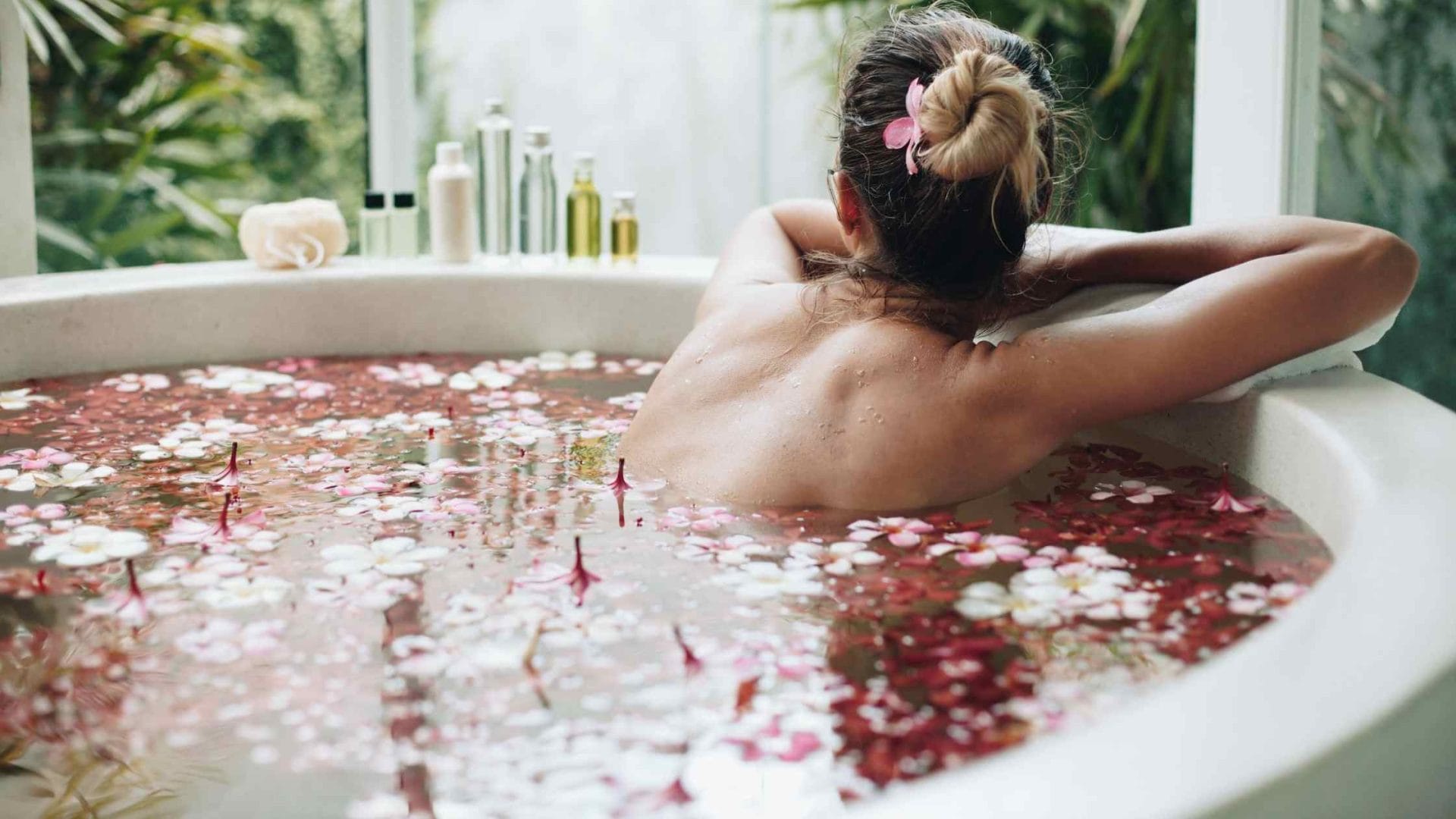 Luxurious flower bath at a Bali retreat for women, featuring vibrant petals in a tranquil spa setting.